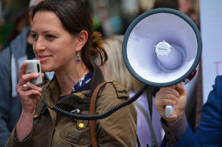 This woman is using a megaphone to allow others to hear her speech. If she is speaking with a Slavic accent American listeners may have difficulty understanding her message. In this case turning up the volume does little good. The post explains why. 